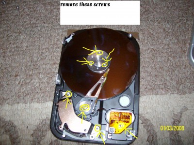 4remove the disk,magnet,reading eye, screws.JPG